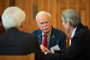 Three people talking to each other