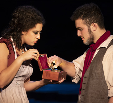 A woman opening a box to a man. Links to Beneficiary Designations